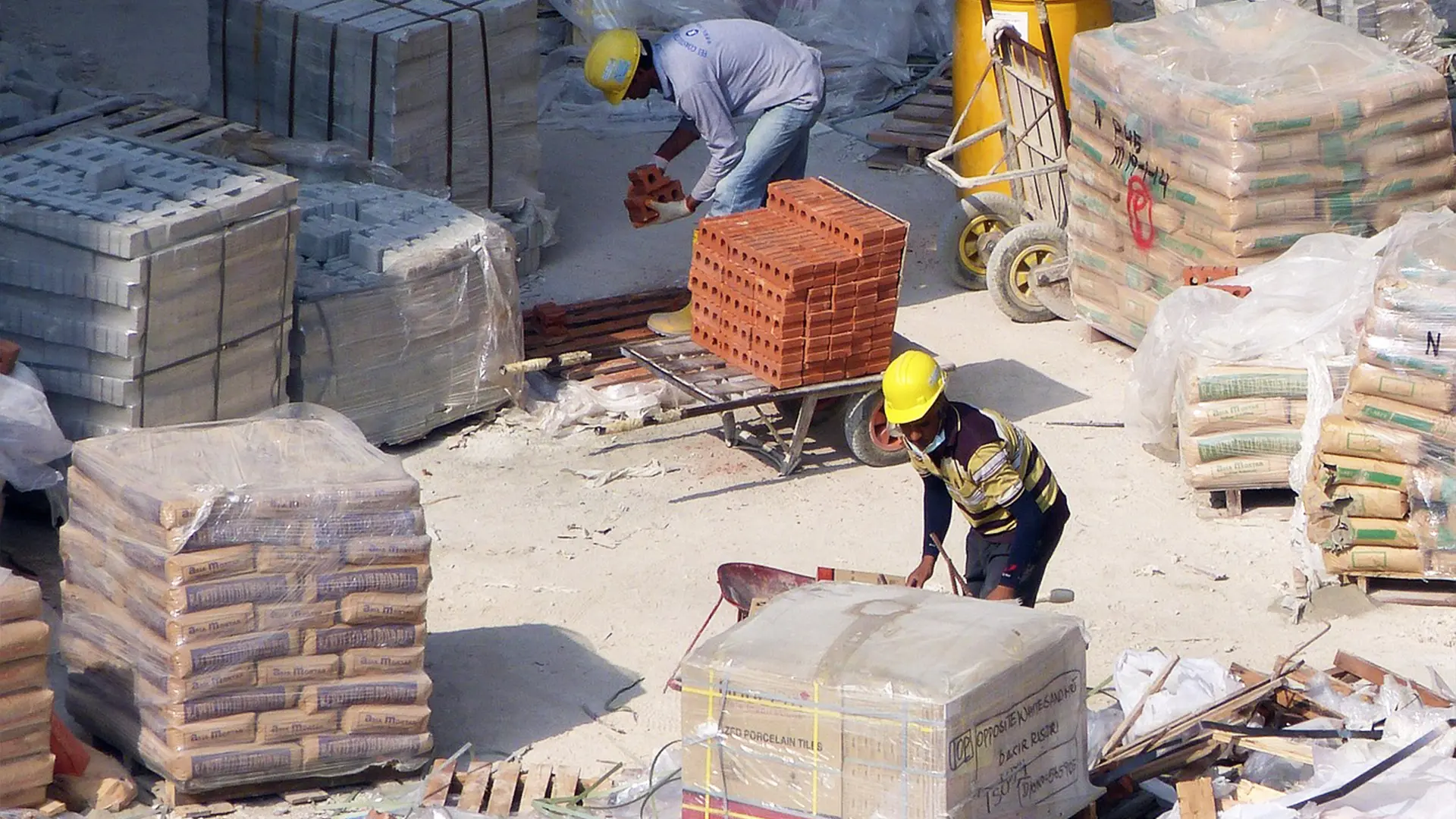 Workers gathering materials on a commercial job site